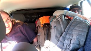 Cramming our luggage into a car